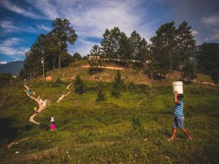 People carrying water bucket